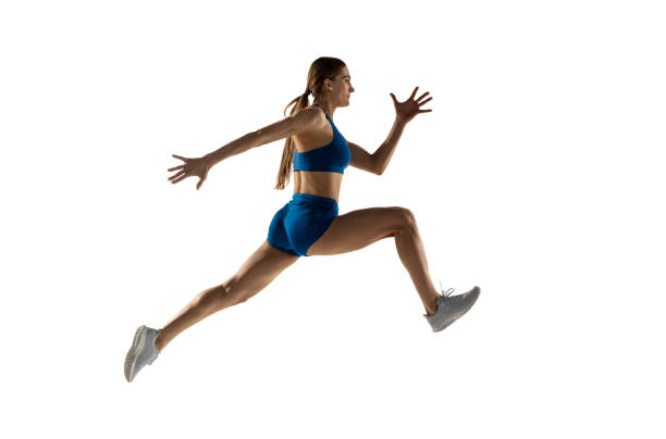 istock Young woman track athlete training isolated over white studio background. 1310060780