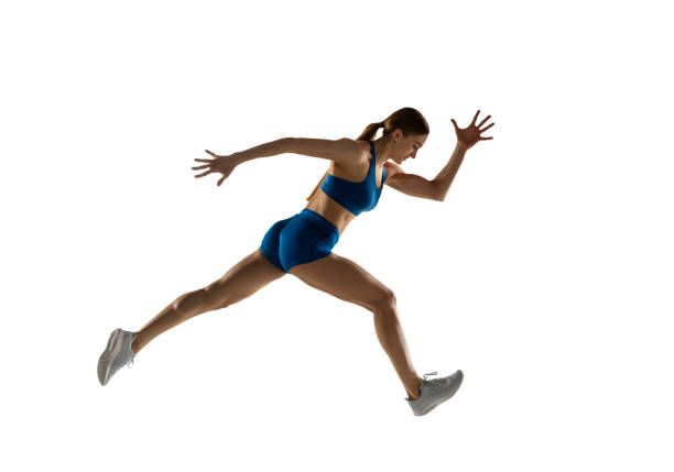 istock Young female track athlete training isolated over white studio background. 1310060782