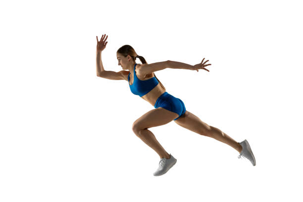 istock Young female track athlete training isolated over white studio background. 1310060793