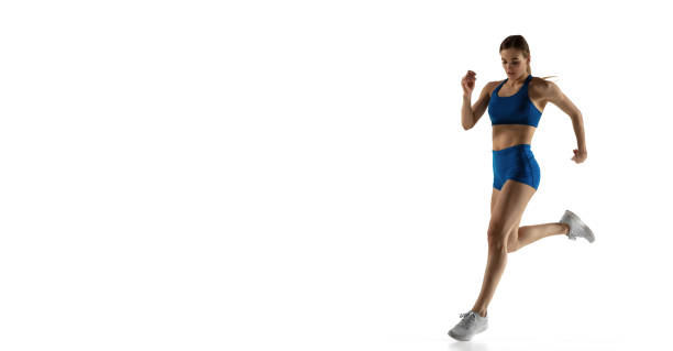 istock Young woman track athlete training isolated over white studio background. 1310060798