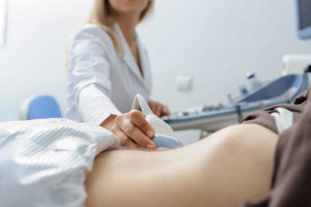 istock Doctor  examination a man at abdomen  Usg 1310061235
