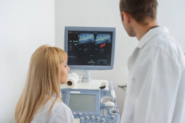 istock Two doctors looking at the ultrasonography divice 1310063050