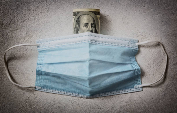 istock Medical mask and money 1310064814