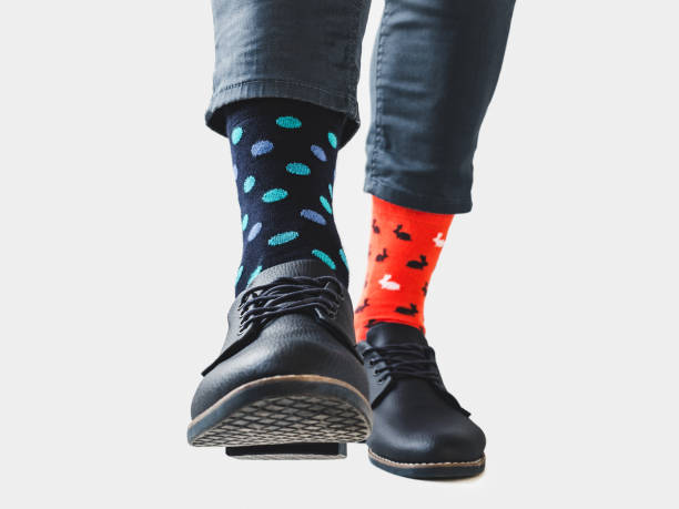 istock Men's legs, trendy shoes and bright socks 1310066331