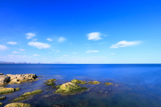 Seaside scenery, the sea under the blue sky, the rocks on the sea.