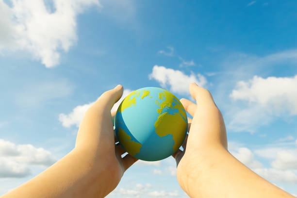 istock close-up of two hands holding planet earth 1310067047