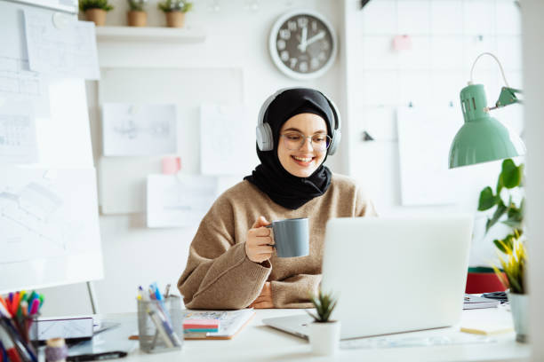 istock Middle Eastern woman working on laptop in office and using internet during online course 1310070629