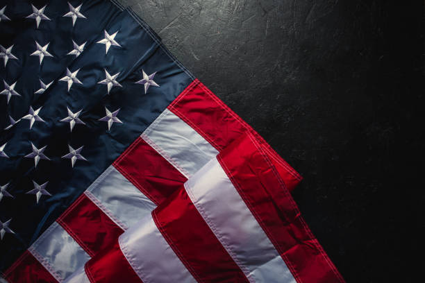 istock Flag of USA on dark background 1310072135