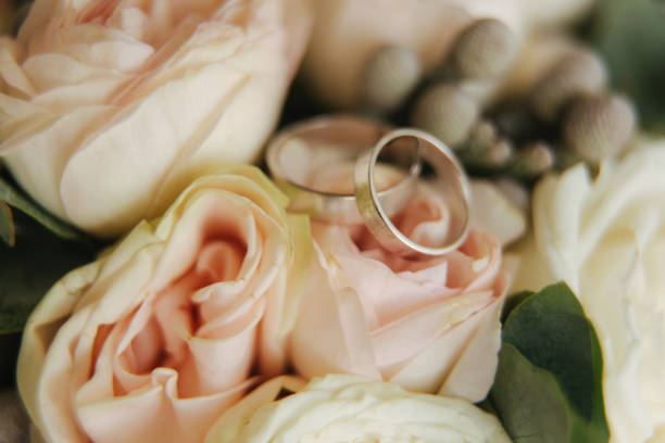 istock White gold rings on wedding bouquet. flowers 1310074408