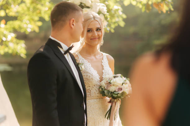 istock Happy newlyweds on thier wedding ceremonny outside. Just married 1310075540