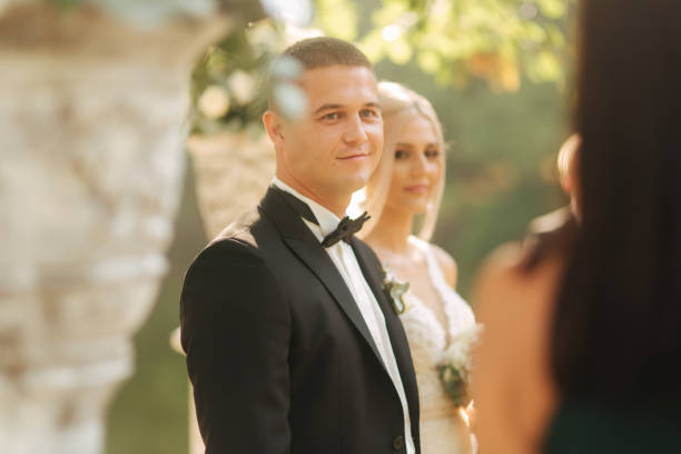 istock Happy newlyweds on thier wedding ceremonny outside. Just married 1310075552