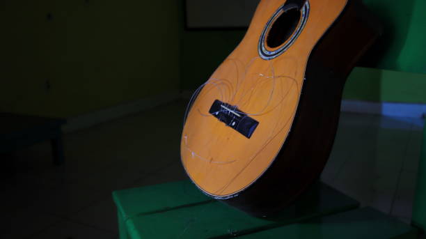 istock A damaged acoustic guitar, with the strings not attached, can't be plucked 1310076756