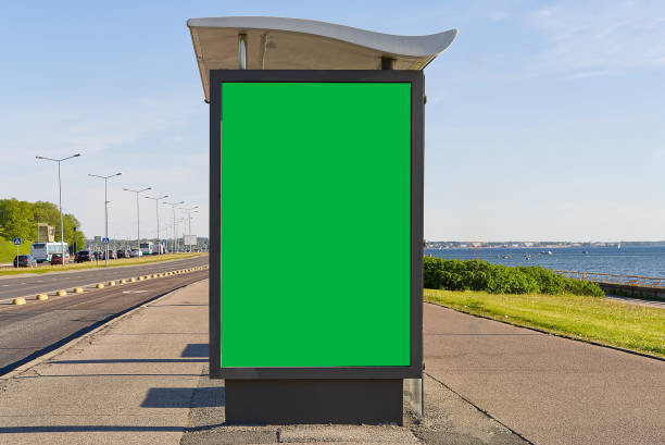 glass bus stop by the sea, with a chroma key advertising space. Blank billboard and outdoor advertising. Mockup poster outside. Tallinn, Estonia. Modern glass bus stop by the sea, with a chroma key advertising space. Blank chroma key billboard and outdoor advertising. Mockup poster outside. Tallinn, Estonia. banner commercial sign outdoors marketing stock pictures, royalty-free photos & images