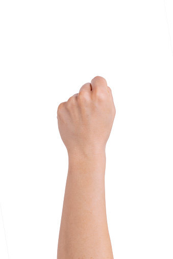 Women's hand closed to the fist from above against white background