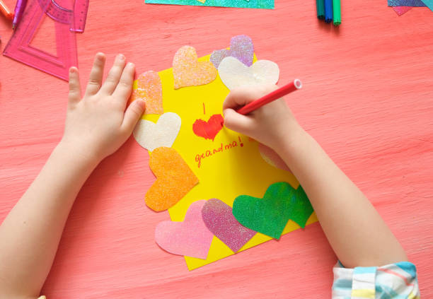 istock Little girl making card for grandma. 1310084385