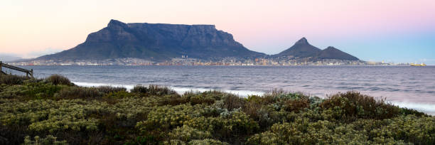 istock Table Mountain silhouetted against the morning sky 1310084493