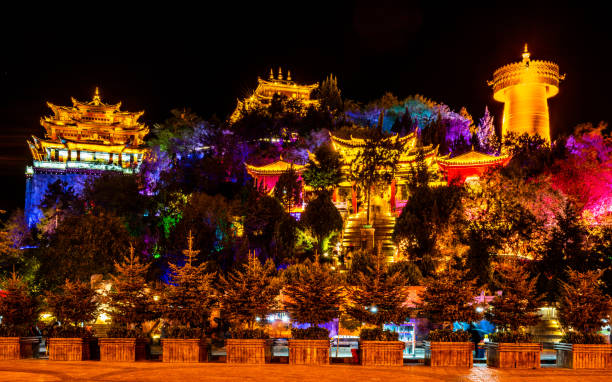 istock Guishan Dafo Big Buddha temple colourfully illuminated at night long exposure wide angle shot in Shangri-La Yunnan China 1310085384