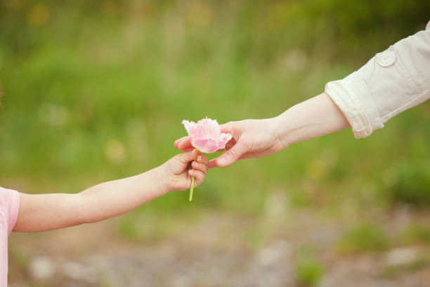 istock Midsection Of Couple Holding Hands 1310088270