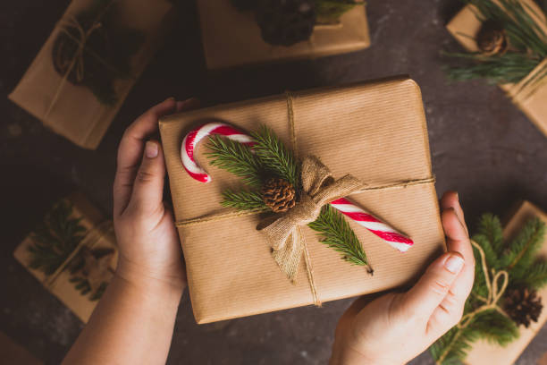 istock Midsection Of Woman Holding Leaves 1310088565
