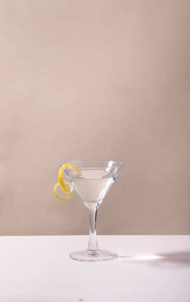 istock Glass of lemon drop martini cocktail on table against grey background 1310089539