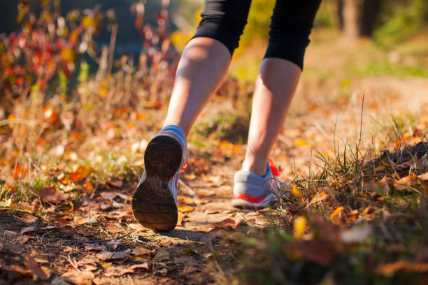 istock Low Section Of Person Running On Field 1310089779