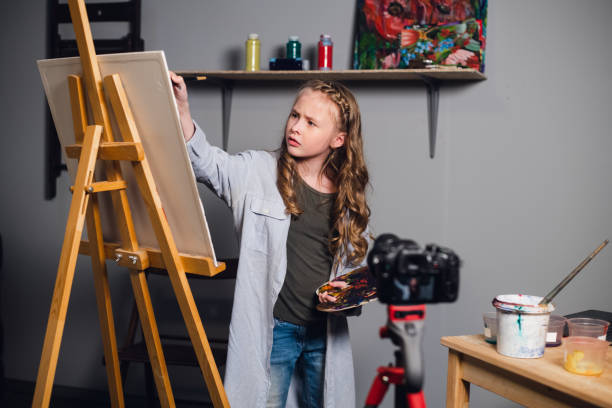 istock a young blogger girl at home leads a remote masterclass on drawing pictures during quarantine 1310091174
