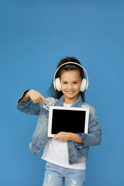 istock cute little child girl shows empty tablet 1310091279