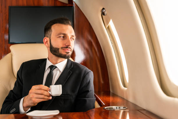 istock Businessman flying on private jet 1310092396