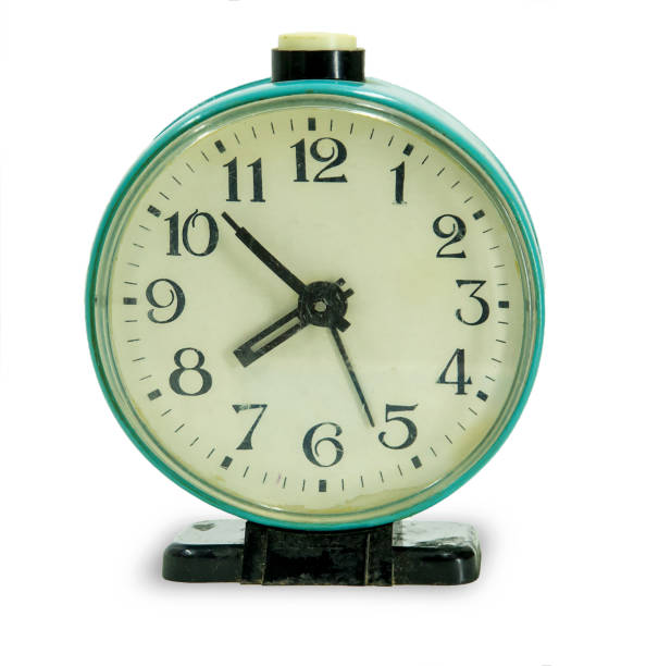 istock green vintage alarm clock isolated on white background 1310093592