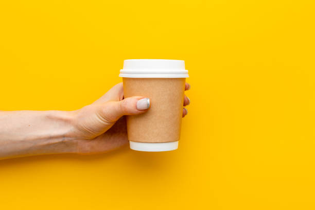 istock Paper cup with coffee in hand. Coffee take away concept 1310093647