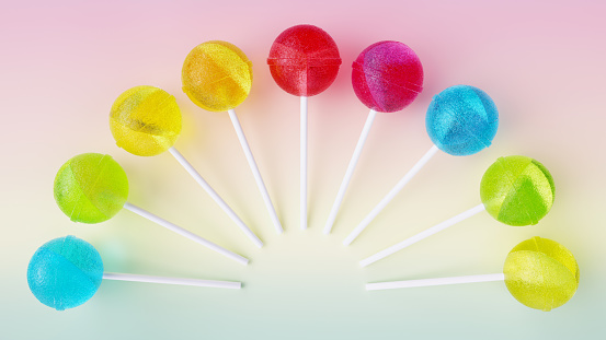 Different colors lollipops isolated on a colored background. 3D rendering.