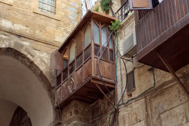 Old building with a balcony on a rainy day near the Yafo Gate in the old city of Jerusalem, Israel