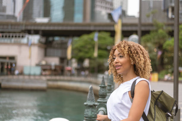 istock Female tourist sightseeing along city's waterfront 1310097595