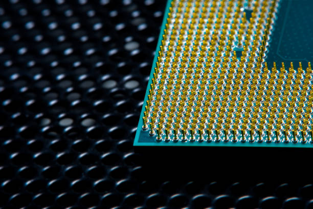 istock Close-up of a part of a microprocessor in soft focus under high magnification. Dark background with detail of a computer component under a microscope 1310101557