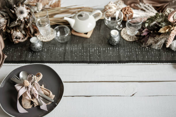 istock Festive table setting design with many hygge-style decor details. 1310101856
