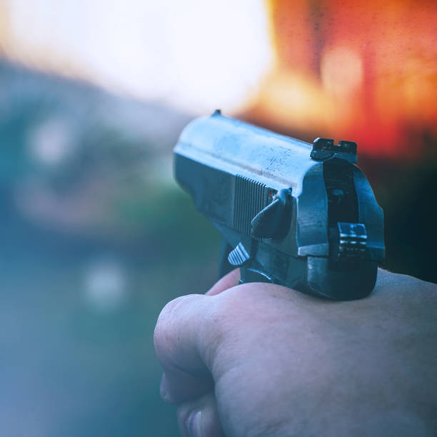 istock Gun in the hands of man 1310101999