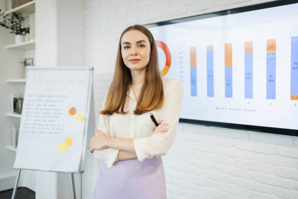 istock Portrait of a young and beautiful teacher, while having an online e-learning lecture. 1310103670