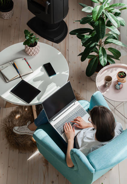 istock Young woman using laptop to work home, remote work 1310106188