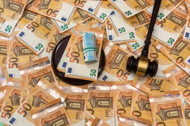 istock Judge hammer on 50 Euro banknotes background 1310106244