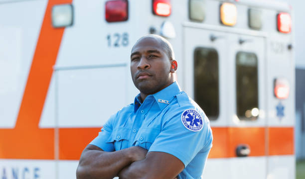 istock Paramedic in front of ambulance 1310106332