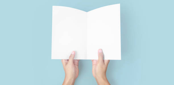 istock Hands holding paper blank for letter paper 1310107178