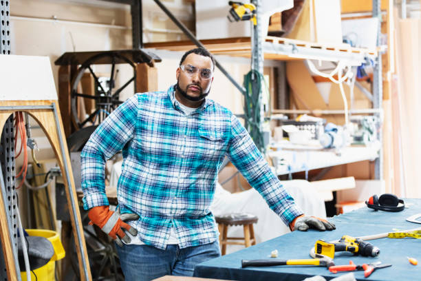 istock Man standing in workshop of plastic factory 1310107501
