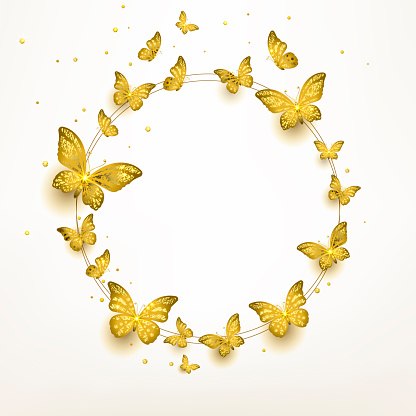 flock of golden butterflies flying in a circle on a light background