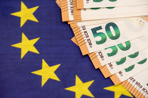 50 euro bills on glag of Europe. finance concept