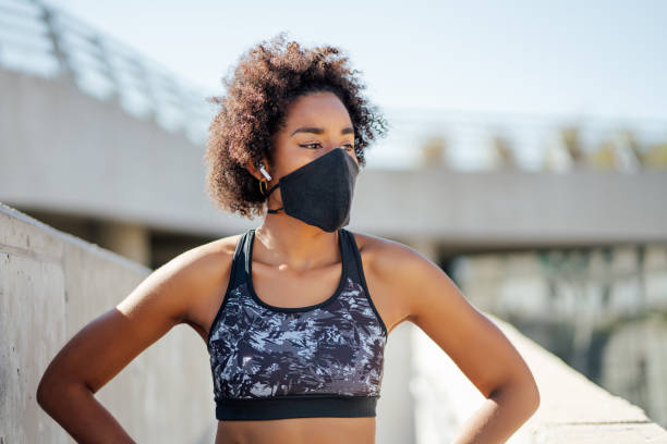 istock Afro athletic woman standing outdoors. 1310108521