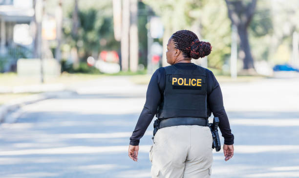 istock African-American policewoman walking in community 1310108953