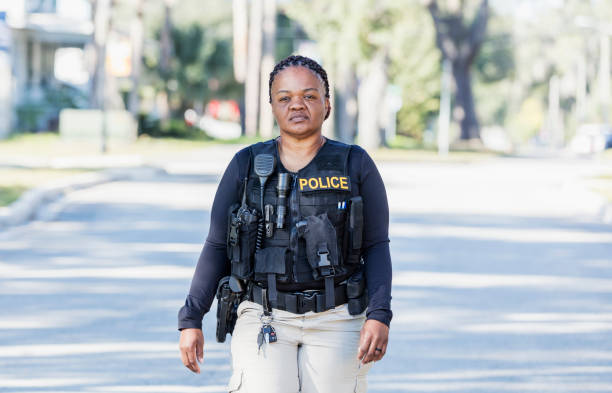 istock African-American policewoman walking in community 1310108972