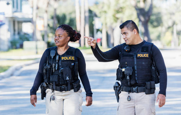 istock Two police officers walking in community 1310109000