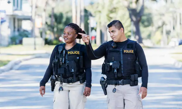 Photo of Two police officers walking in community