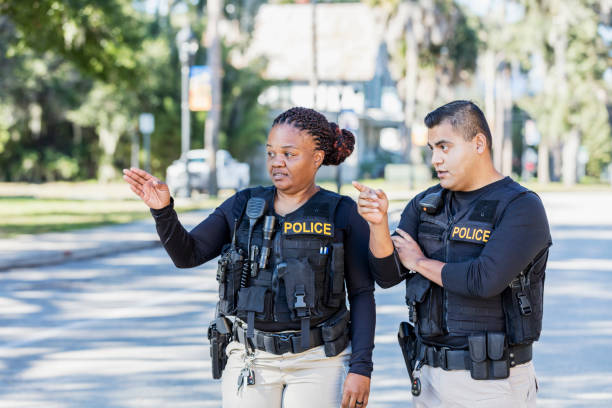istock Two police officers walking in community 1310109052